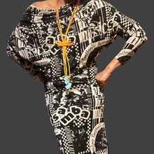 Load image into Gallery viewer, Necklace Orange Swirl Rubber Strands
