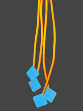 Load image into Gallery viewer, Necklace Orange Swirl Rubber Strands
